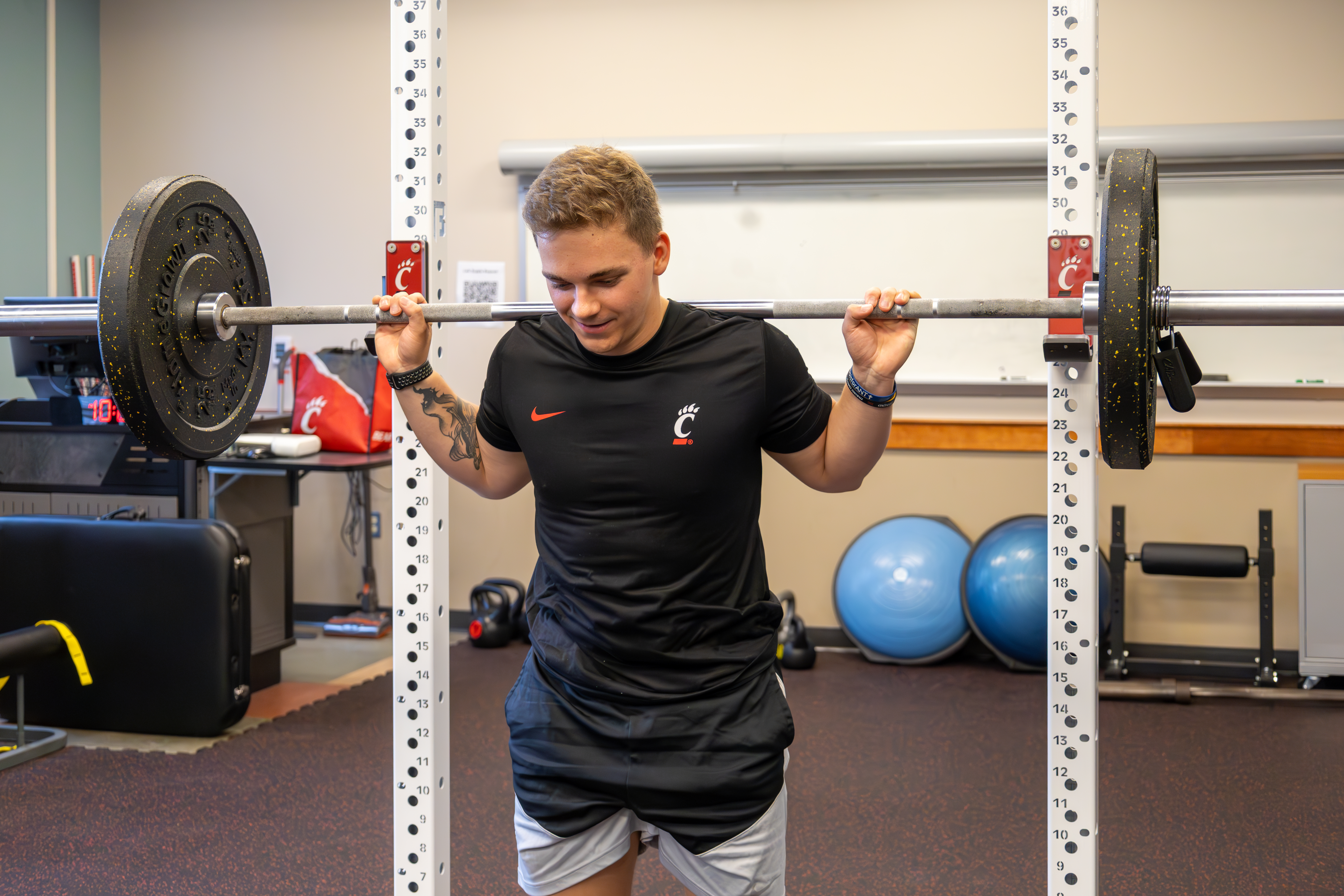 Student lifting weights